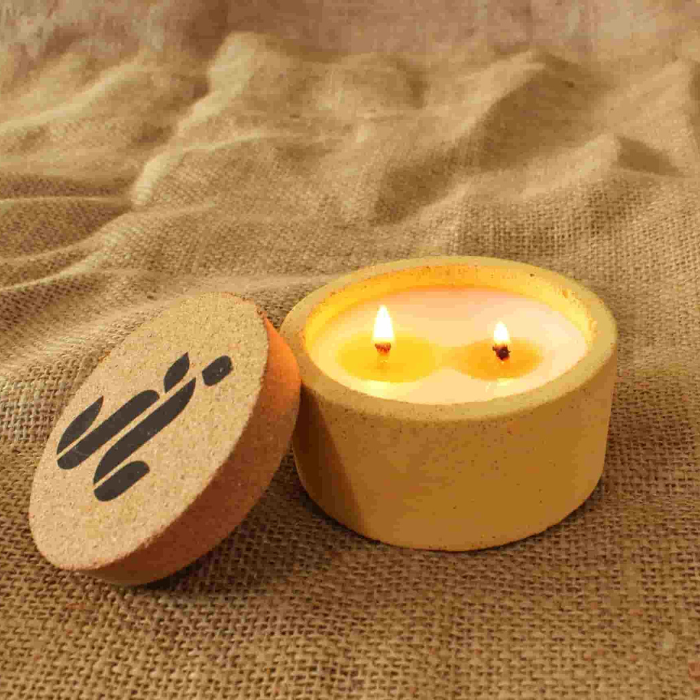 Yellow concrete candle with cork top